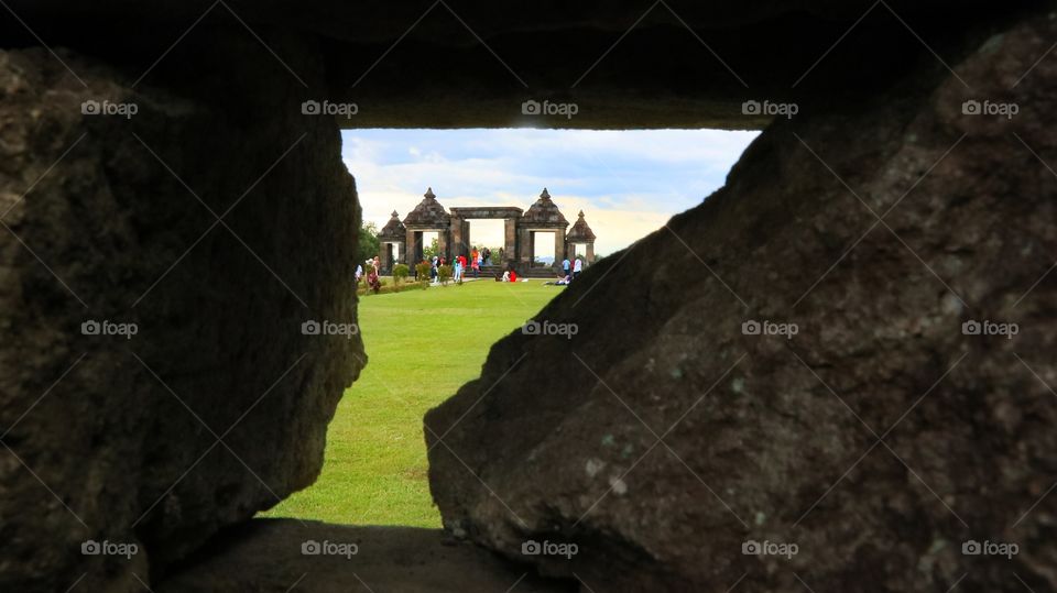 Main gate of Ratu Boko palace seen from a tiny hole on the wall of the other side