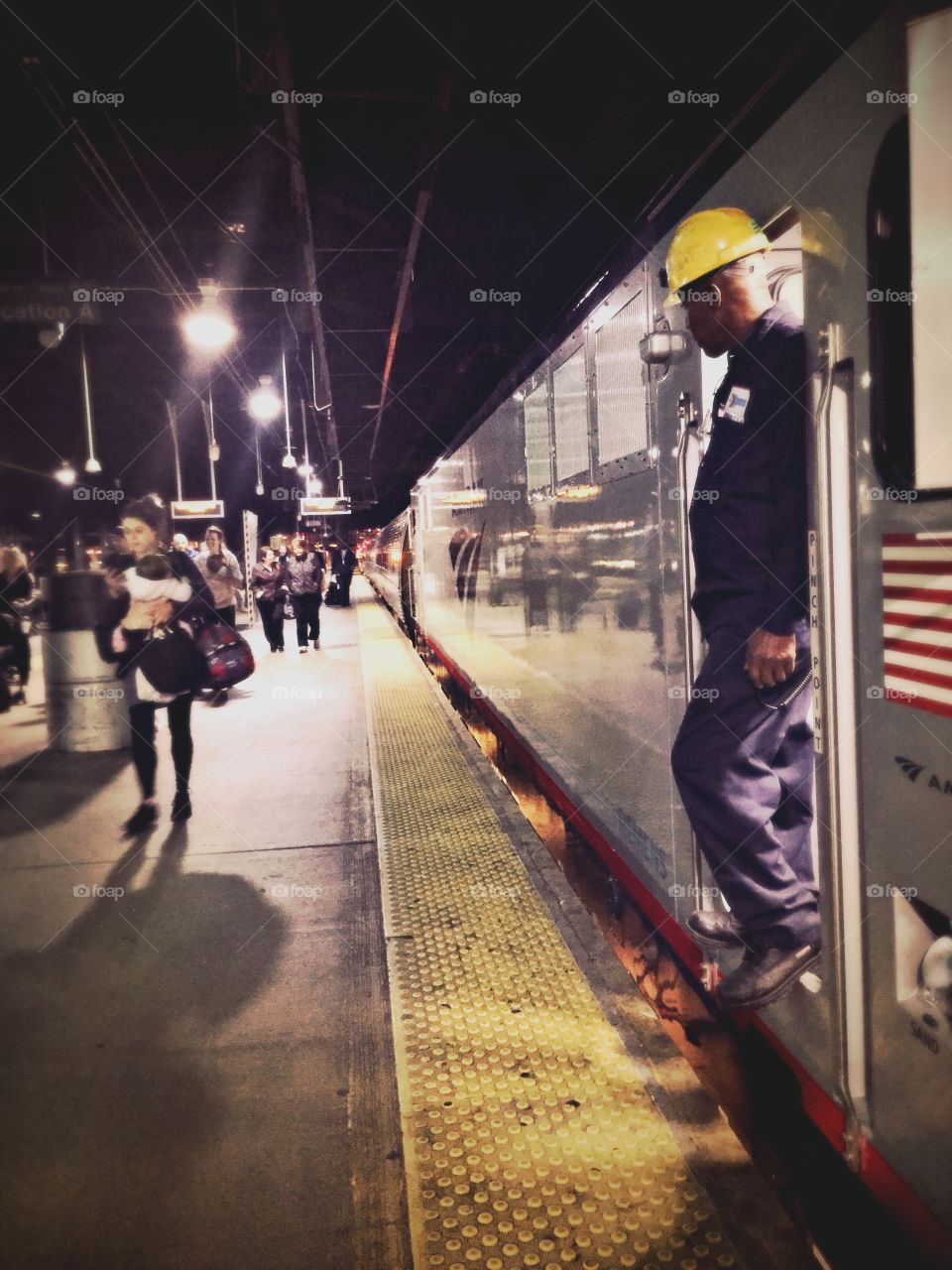 Machinist observe passengers disembarking at train station in Washington DC