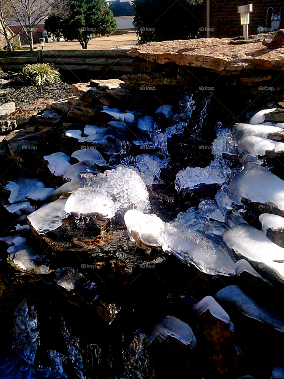 Ice Glazed Rock. Ice covering a rock fountain