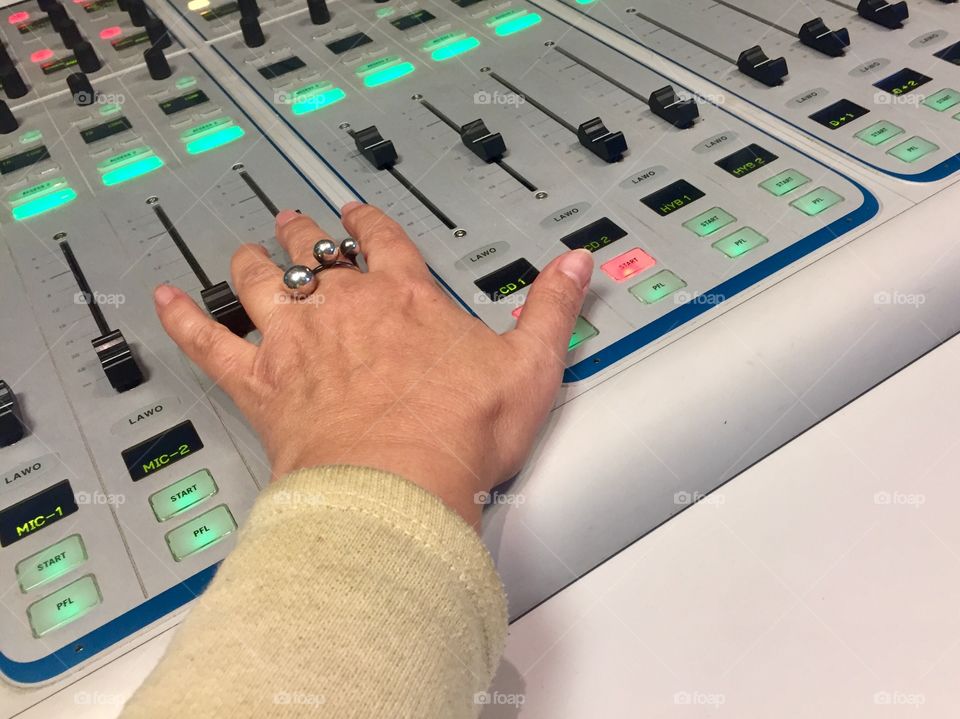 Sound engineer works on a mixing console