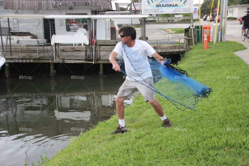 Fisherman with cast net