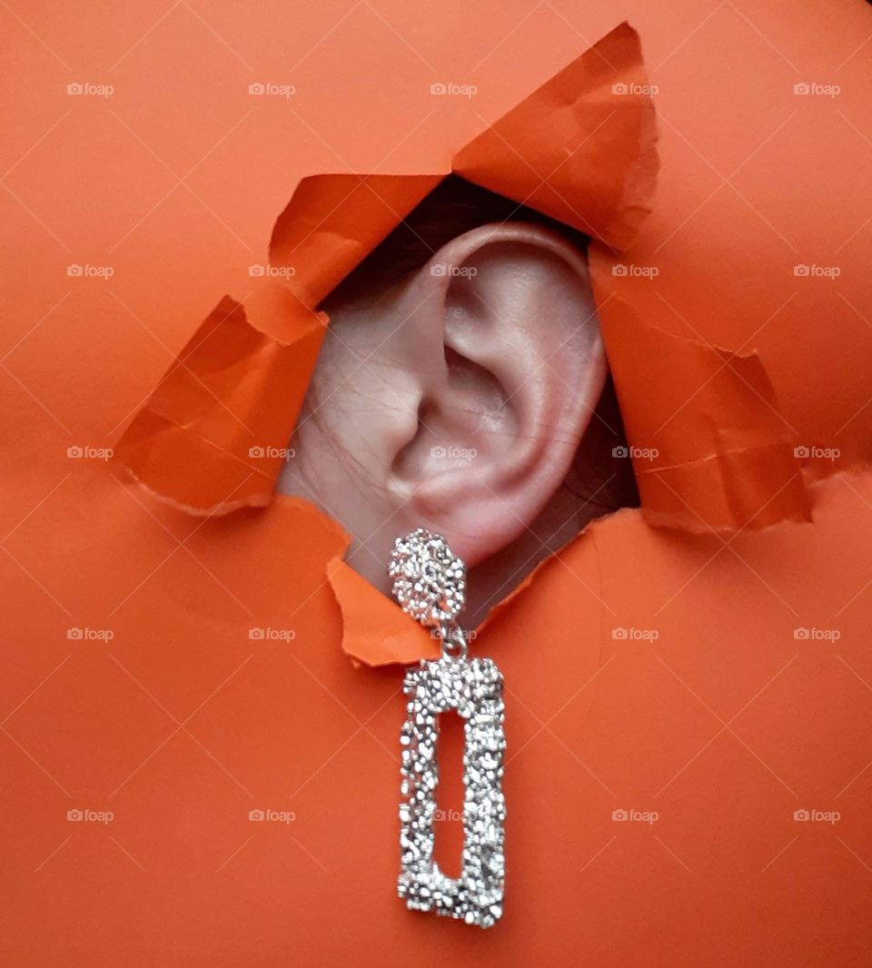 Unusual photo advertisement of silver earrings