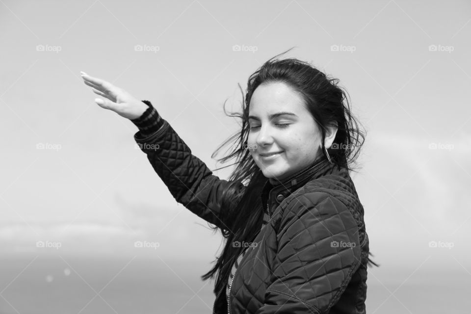 A woman enjoying the wind, San Francisco, Battery Park