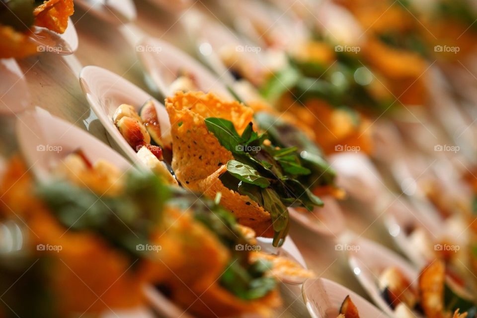 Entree salad dish assembly line ready to be served for a large group