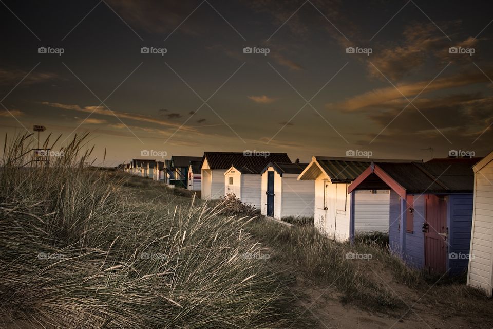 Beach huts at sunset