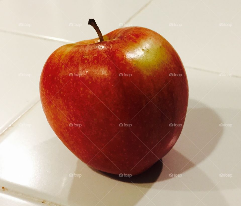 One bright red delicious apple