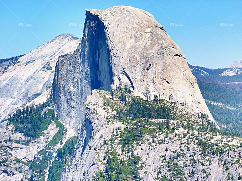 Half Dome towering above Yosemite Valley as seen from Glacier Point