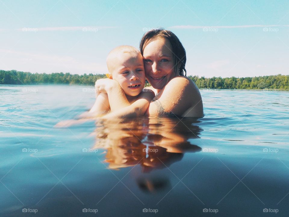 Mother and child in the lake