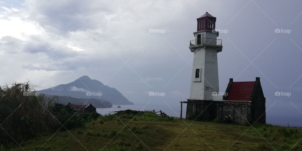 Another peaceful light house overlooking an inactive volcano