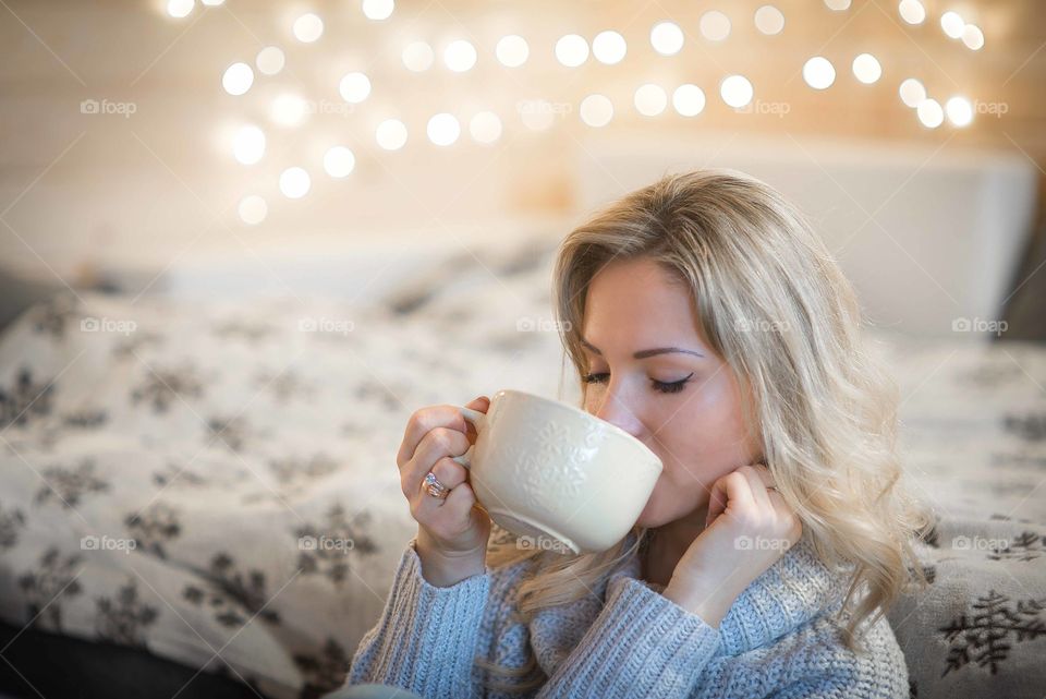 Beautiful woman drinking hot tea