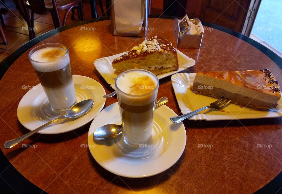 hot coffee with milk and sweets