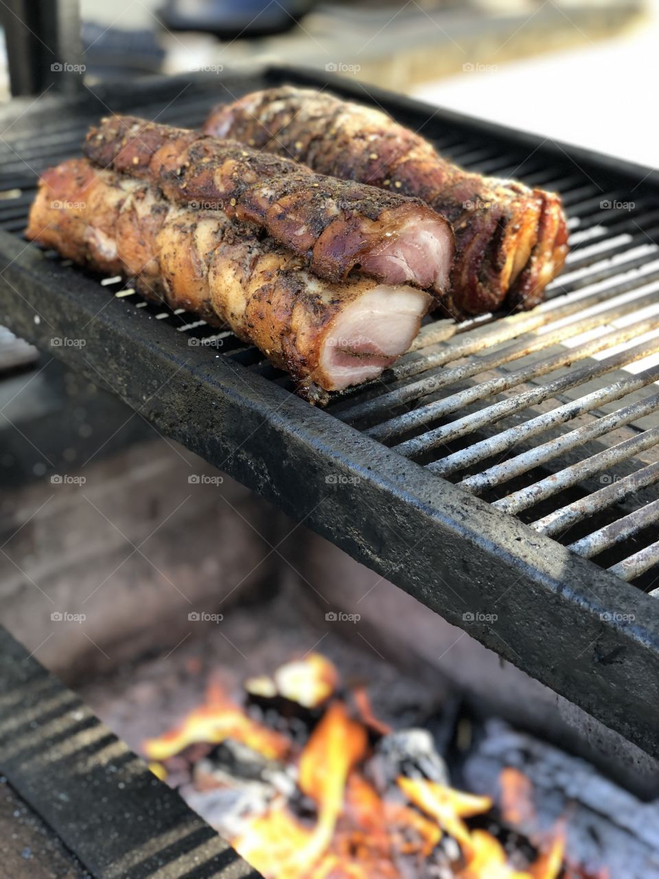 Slow-cooking the Porchetta di Testa over a traditional Santa Maria grill. Who’s hungry?