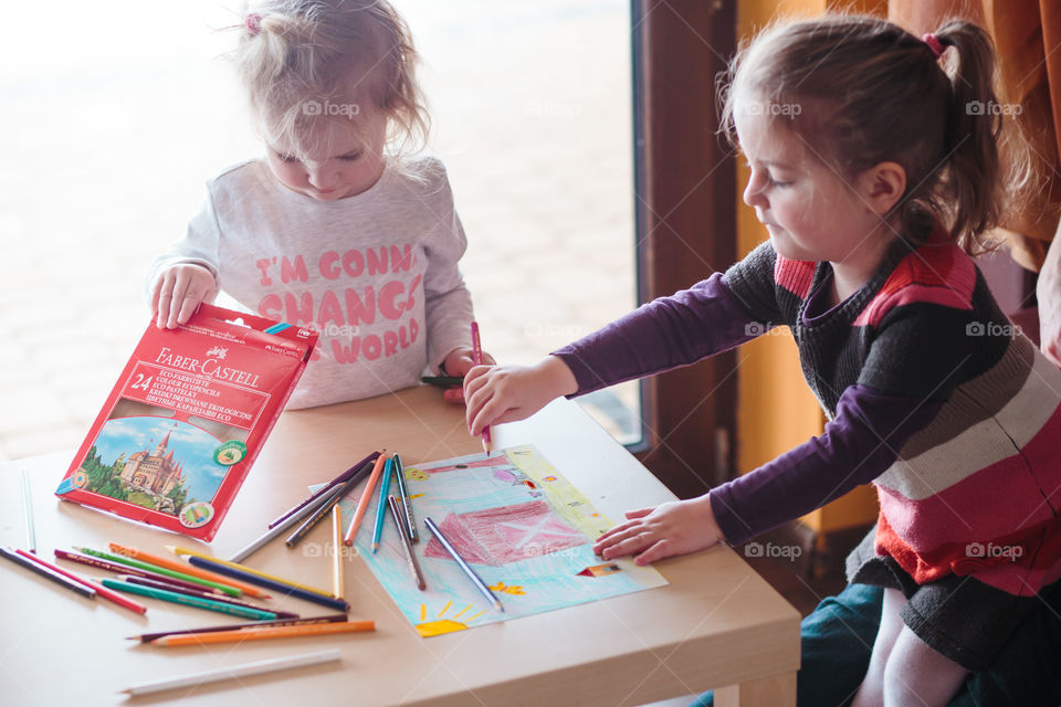 Colours of the world. Children with mom drawing using crayons