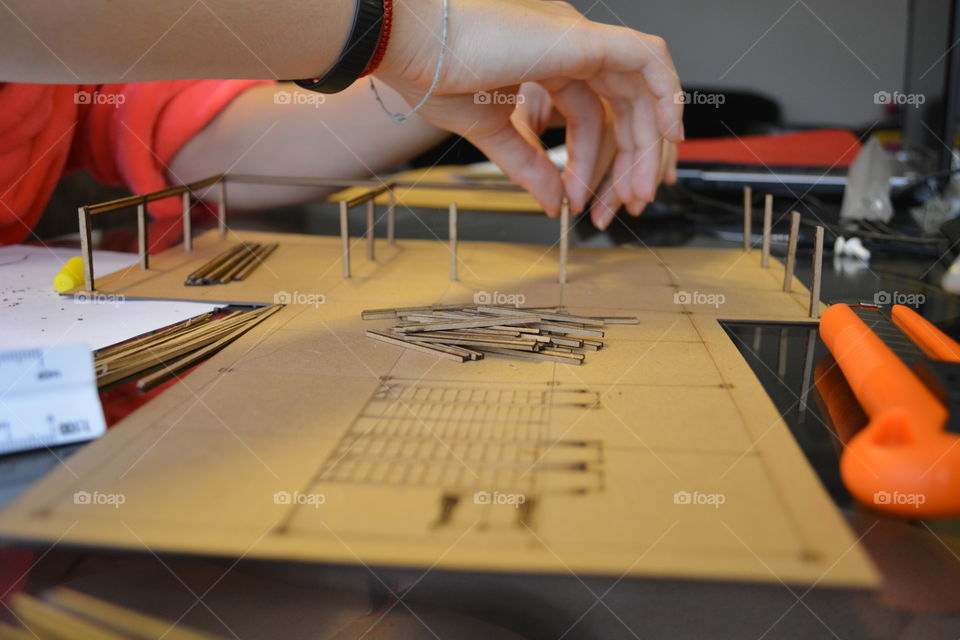 Architecture student building a model