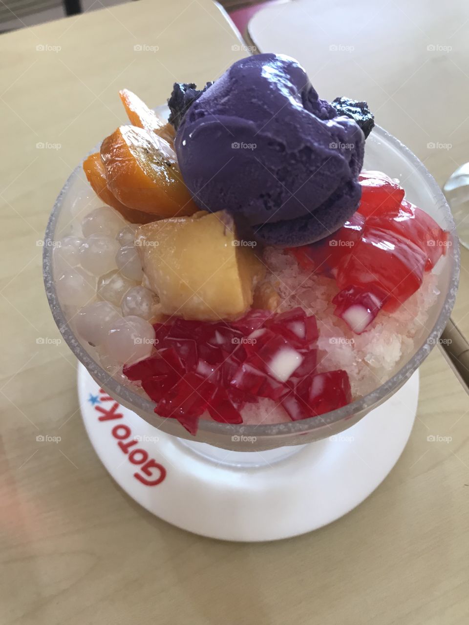 Halu-halo-Tagalog for "mixed" also spelled haluhalo, is a popular Filipino cold dessert which is a concoction of crushed ice, evaporated milk and various ingredients including, ube, sago, (seaweed gelatin), pinipig rice, boiled root crops in cubes. 