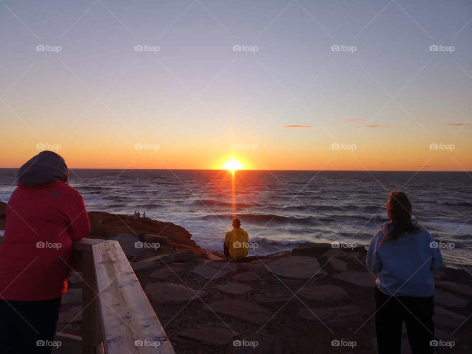 Invitation for contemplating the sunset. Phare Borgot, Îles-de-la-Madeleine, Québec, Canada