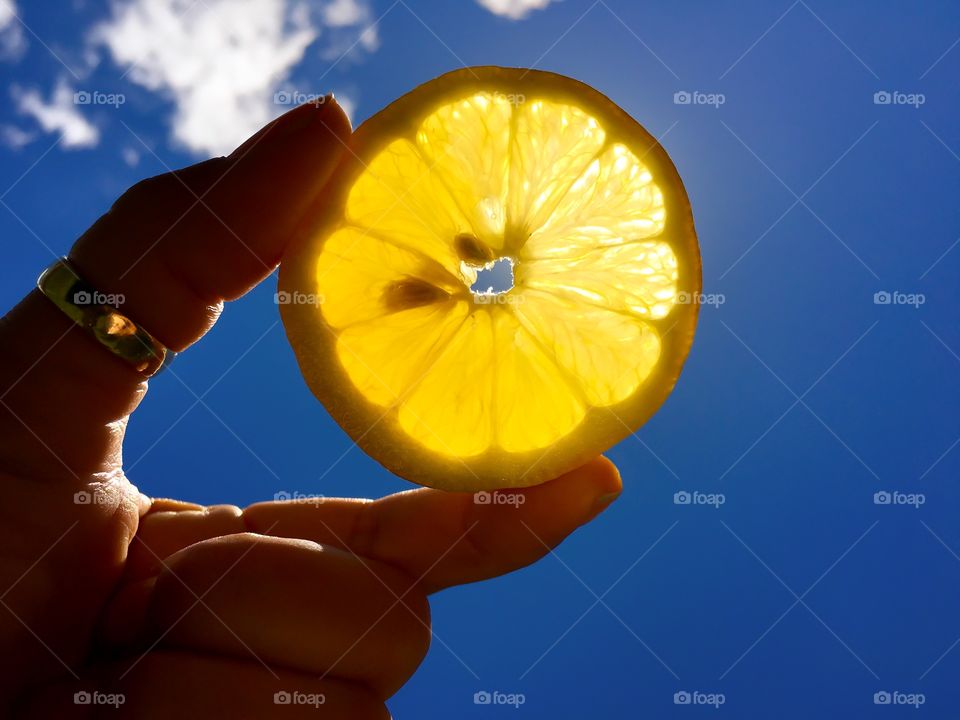 Low angle view of slice lemon
