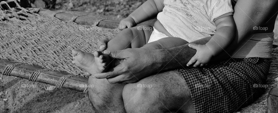 child holds parents hand