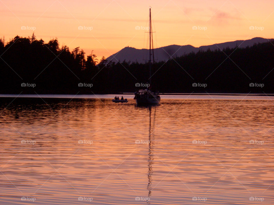 ocean sunset sea boat by fizzlicity. Sunset in Broken Group of islands off Vancouver pacific coast a calm mooring at the end of a days sailing