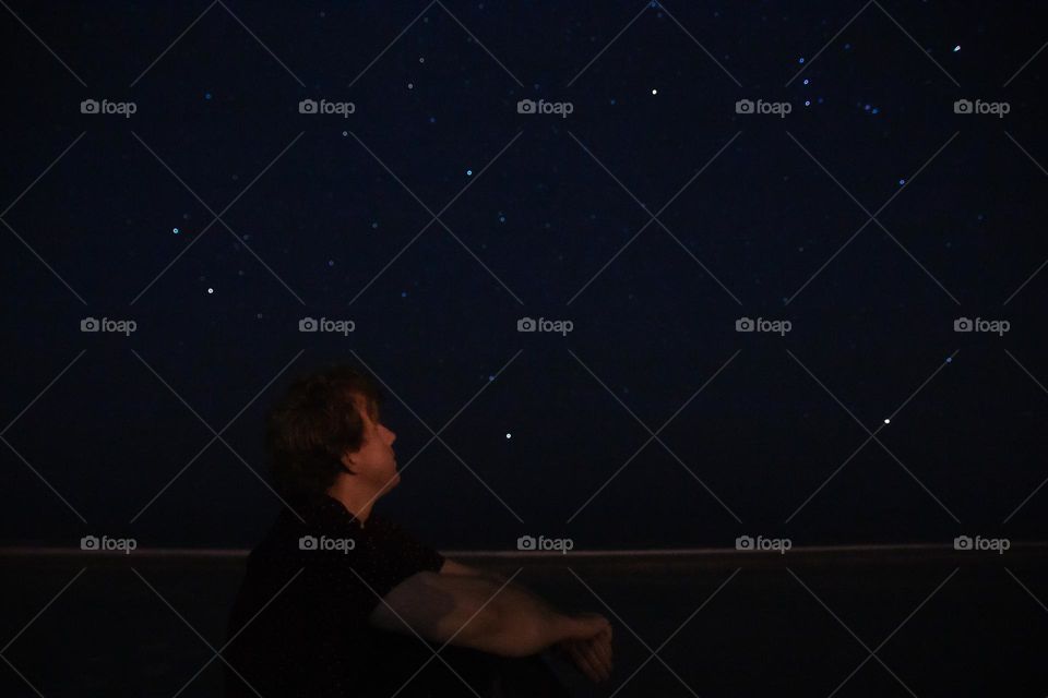 Man looking at the starry sky