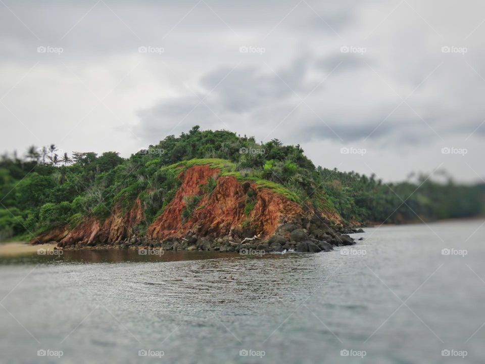 The tip of the island with a cliff coastline.