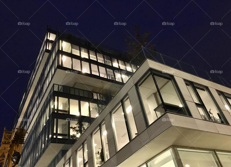 Modern building with twinkling windows 