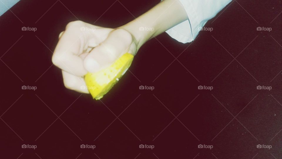 Little Hand Squeezing Lemon.