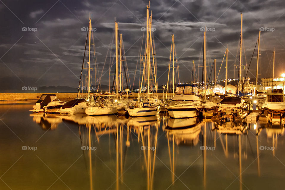 light clouds boats night by chaniaweb