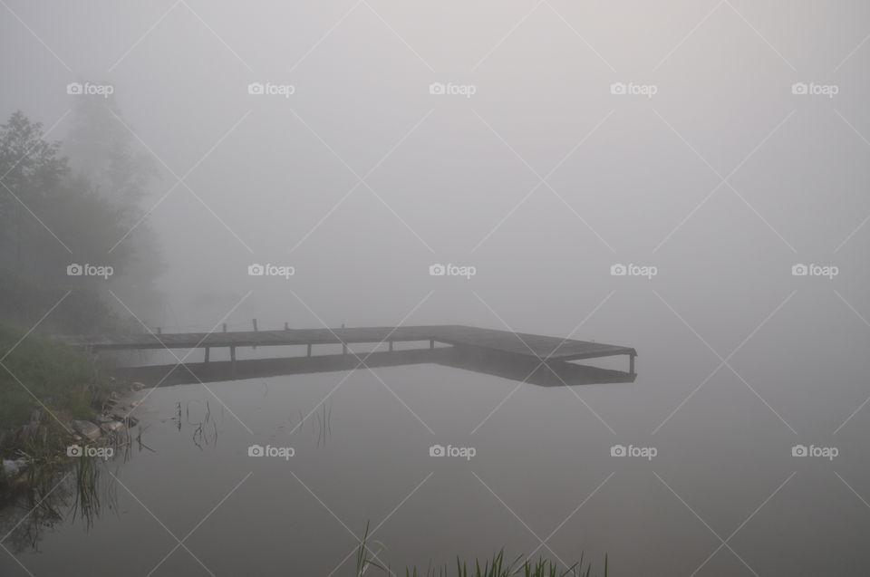 foggy morning at the lake in polish countrydide