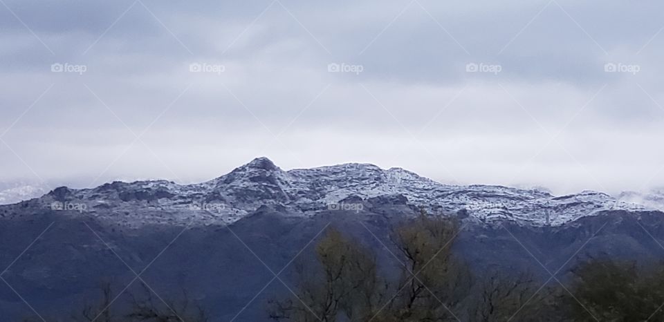 fresh falling snow on the mountains