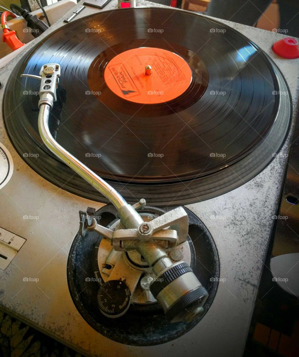 Listening to a record.