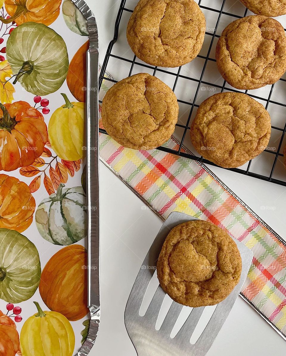 Freshly baked Pumpkin Snickerdoodles for Thanksgiving, baking homemade cookies with kids, placing freshly baked cookies on a cooling rack, making Thanksgiving treats to celebrate with family