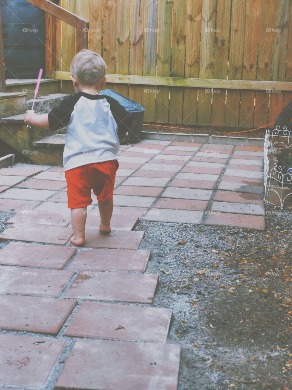 little boy playing outside