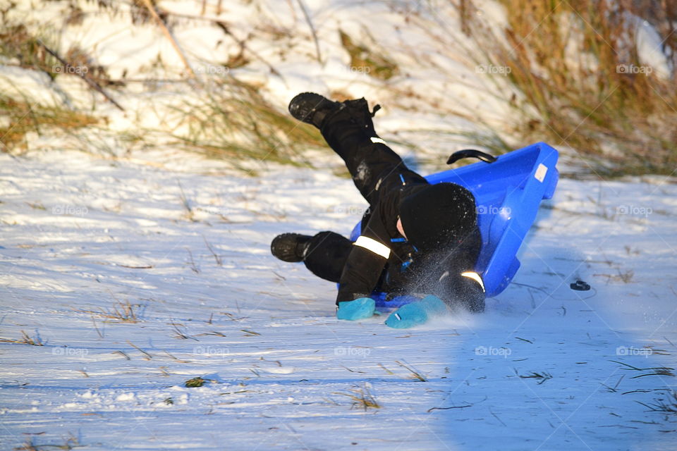 Man falling from sledge