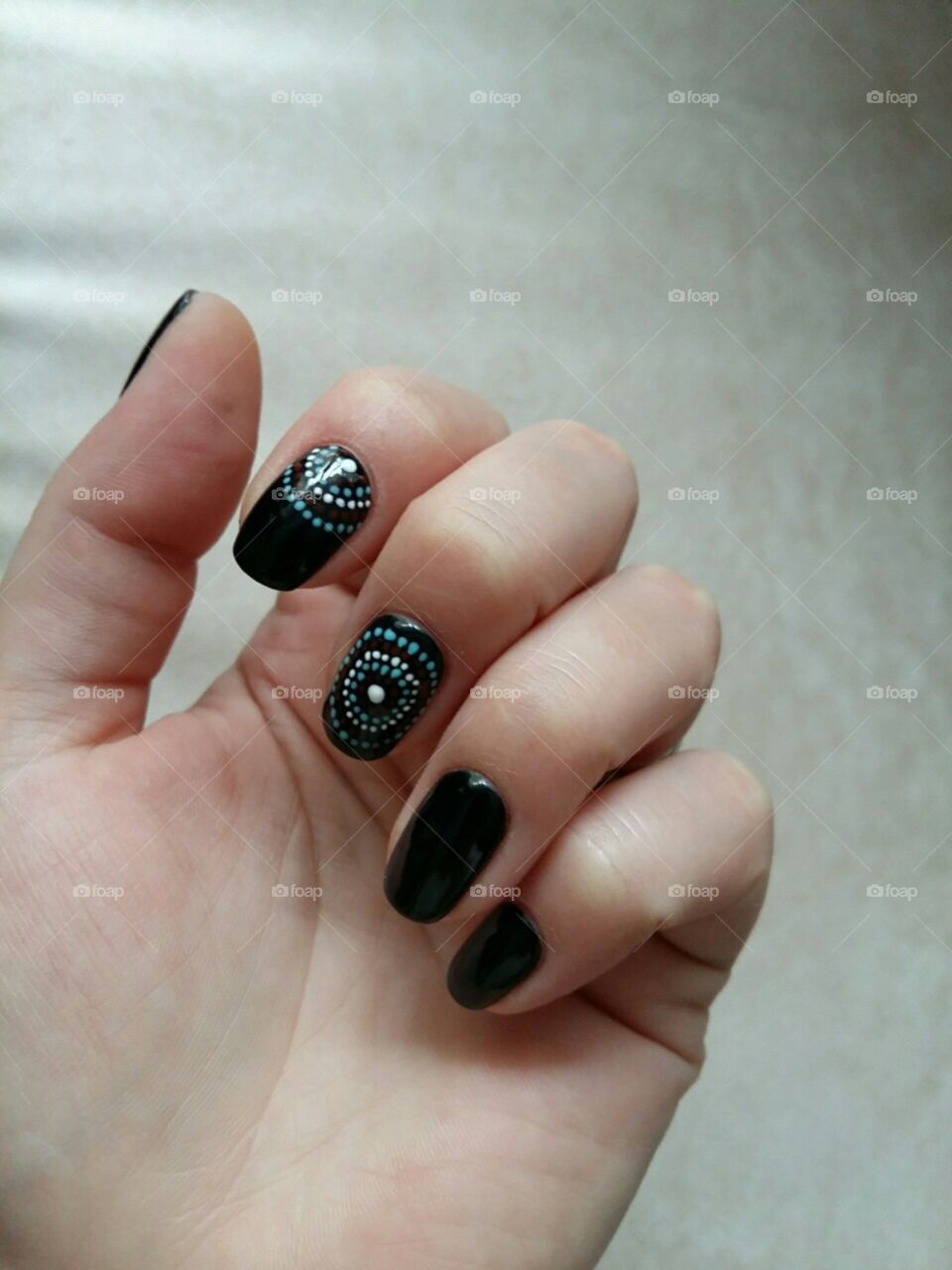 Black manicure with dots in circles