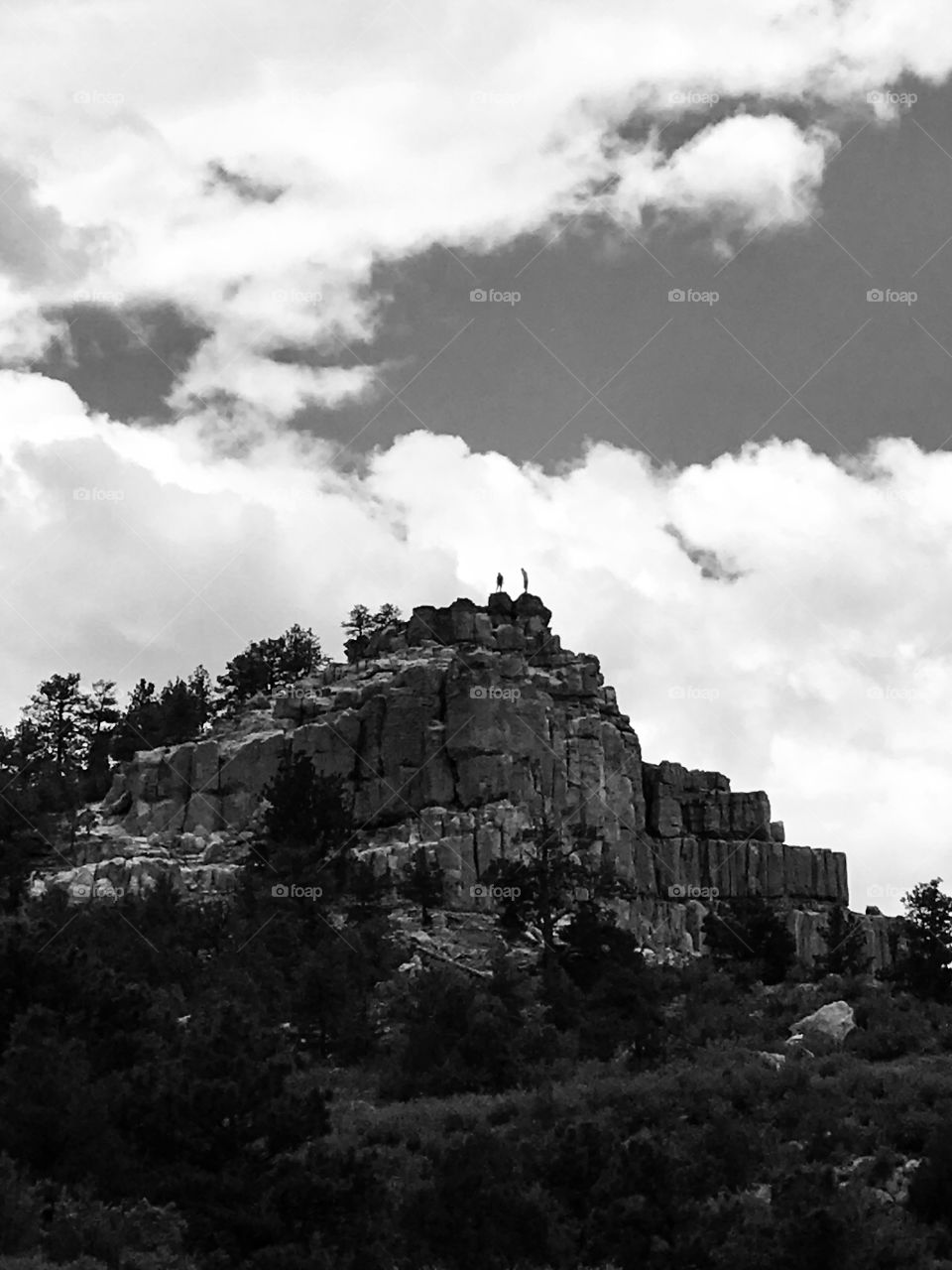 Hikers seen on the top of pulpit rock. I saw them on my hike through the Open Preserve on a beautiful summer afternoon.