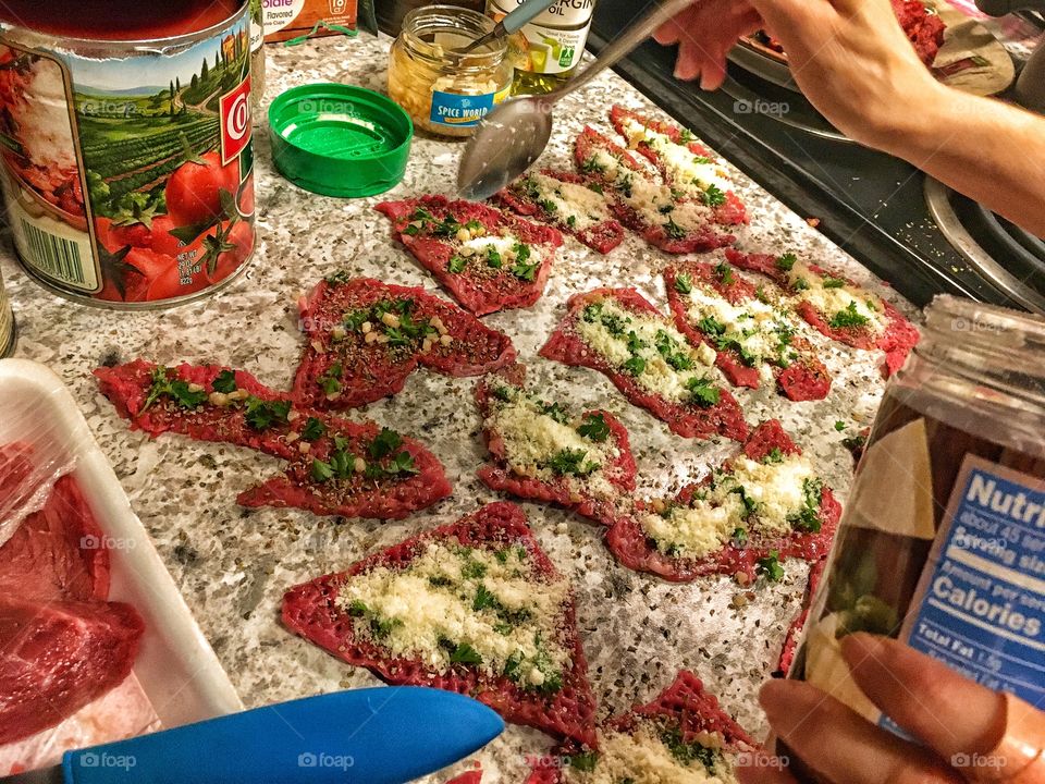 Making an Italian dish called braciola. Stuffed steak in a nice homemade pasta sauce.  