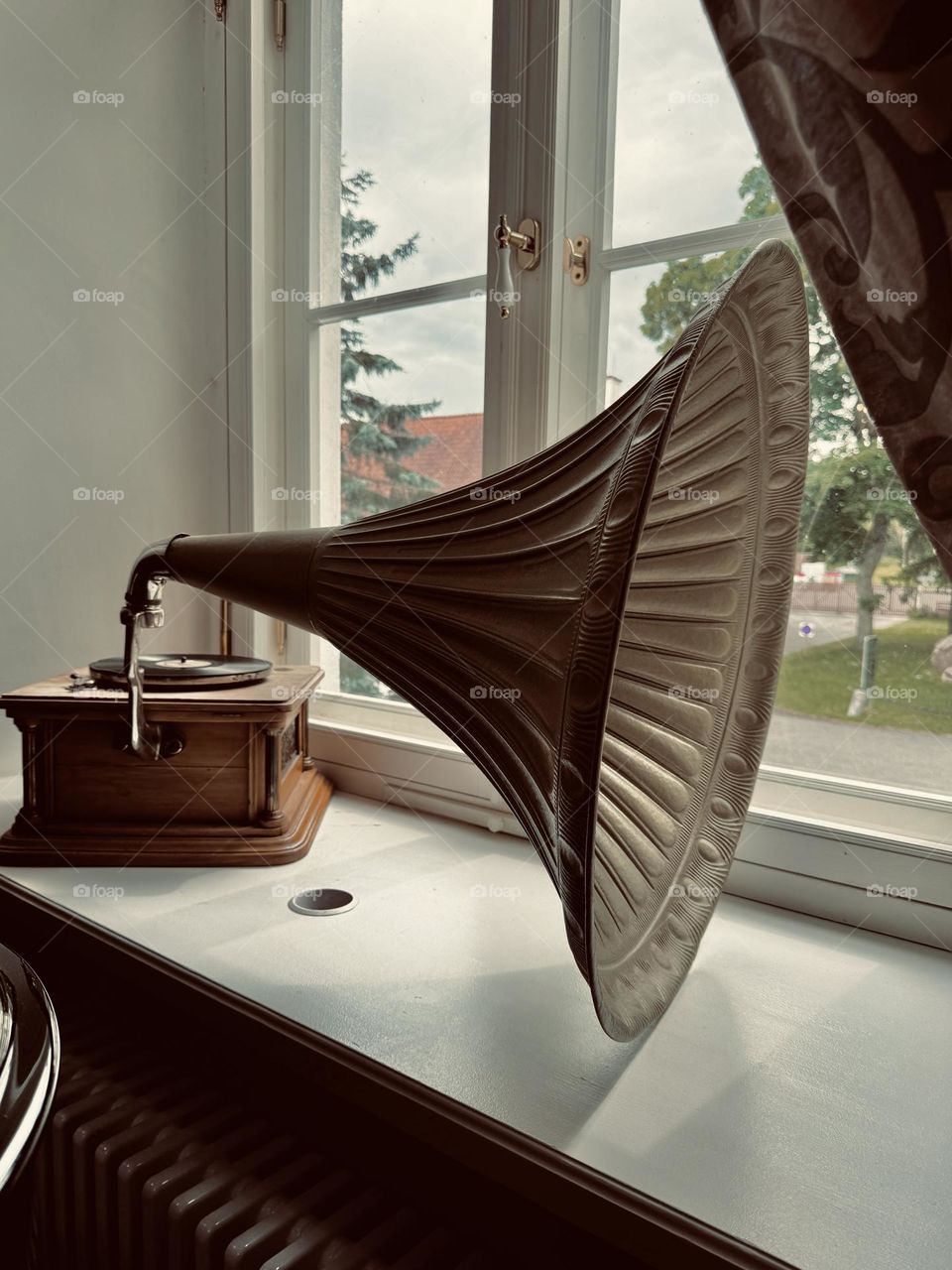Vintage gramophone on the window sill 
