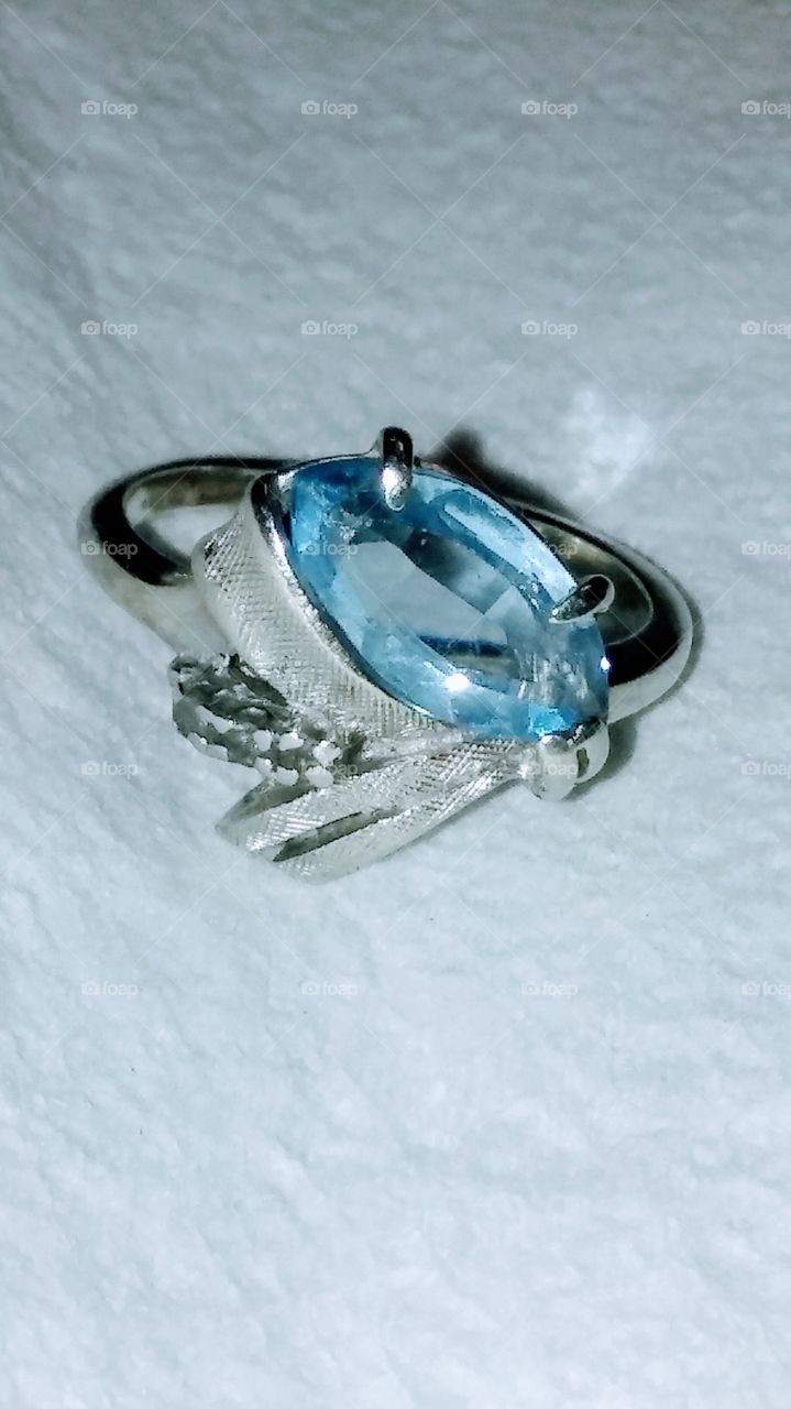 Family heirloom 14k white gold (believed to be aquamarine?) ring - the story is that my great grandfather was stationed in Hawaii during WWII 1941 - he bought this beautiful piece to bring home to Texas and ask for my great grandmothers hand in marriage. It's passing goes to the first daughter of each new generation.