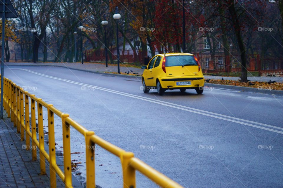 yellow fance and yellow car