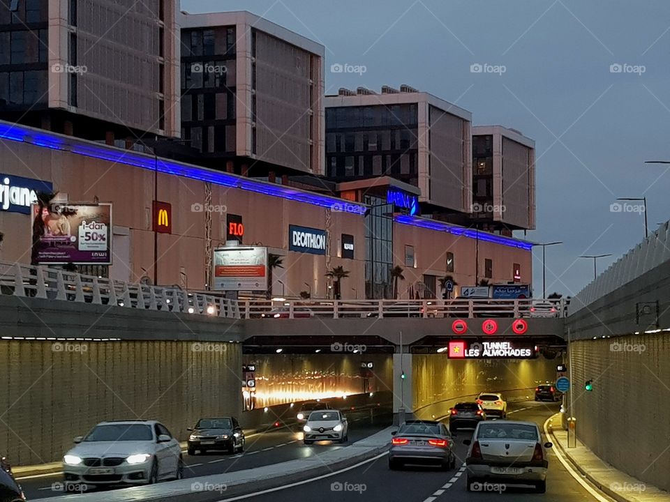 traffic jam on underground face to shopping mall giving a night lights vibe full of excitement