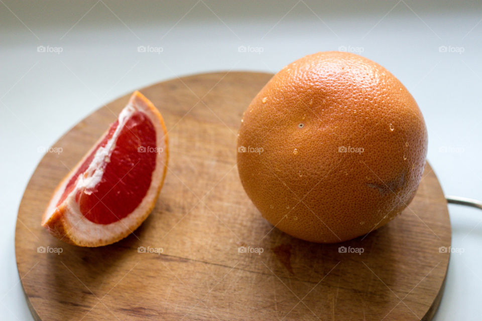 Juicy grapefruite with a piece