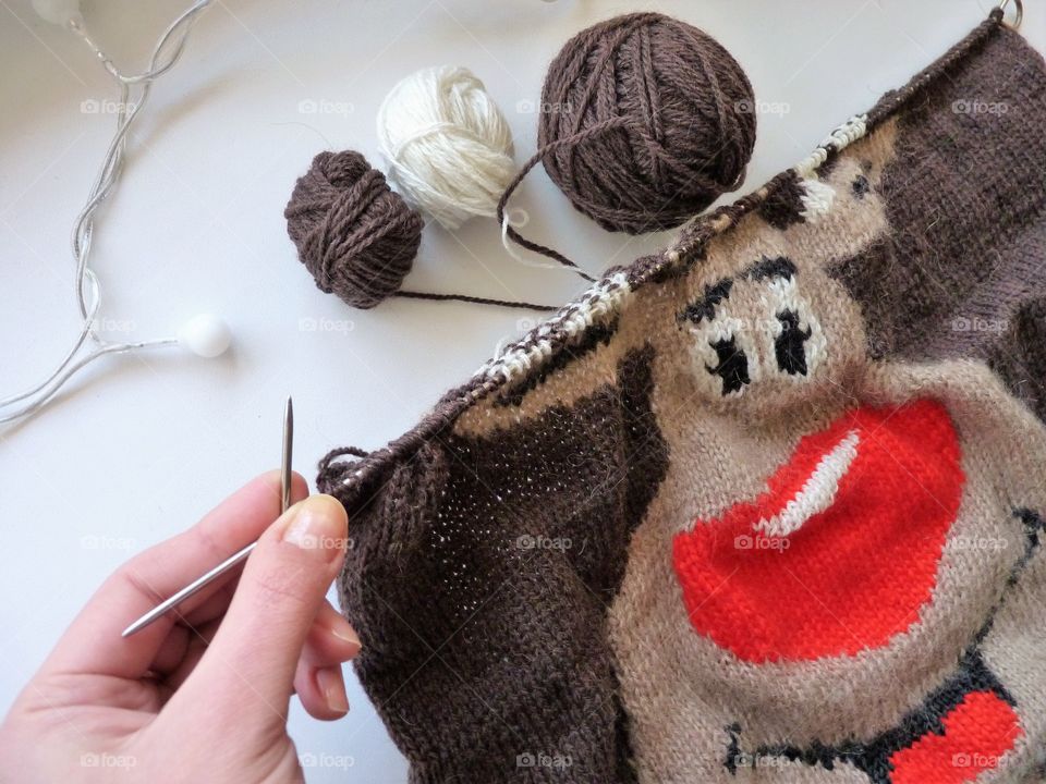 Person doing craft using threads