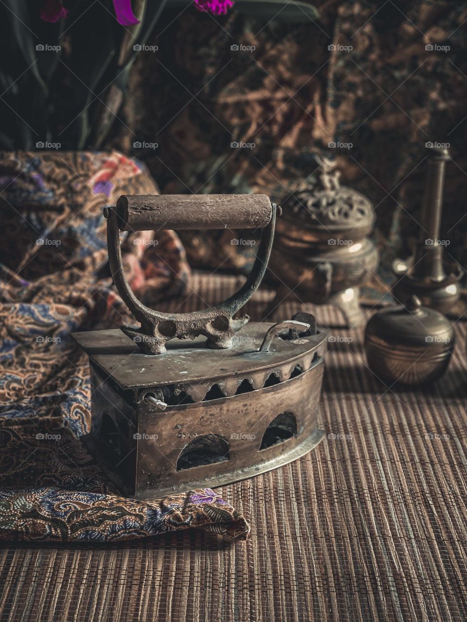 Close up view of a traditional cloth iron in beautiful vintage ambiance 