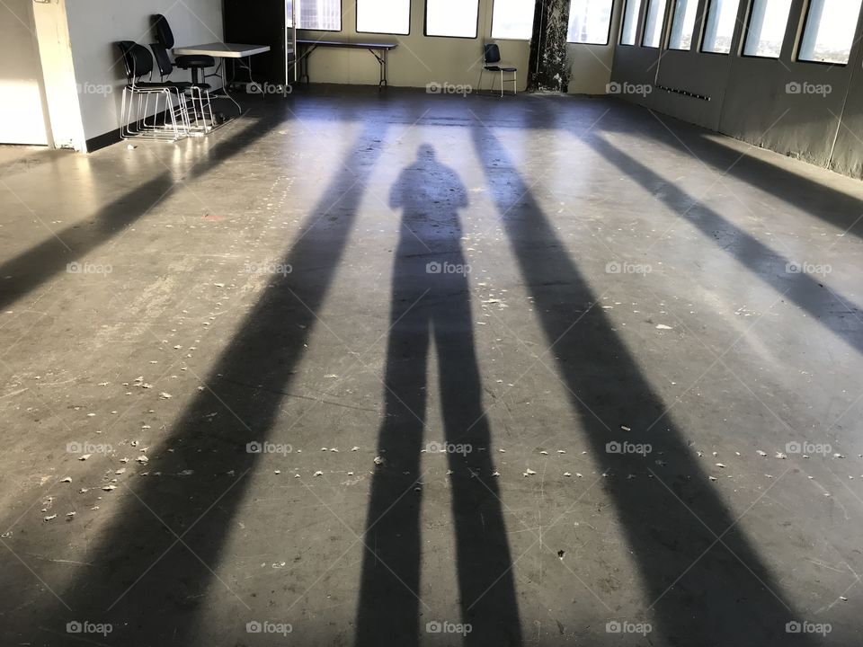 Shadow cast on industrial floor 