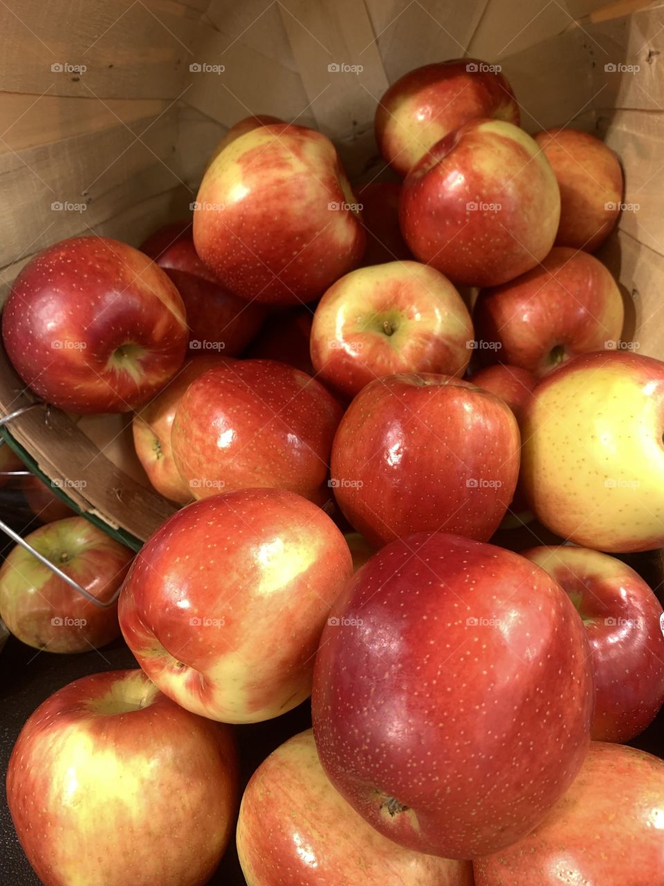 Apples and a wicker basket for sale