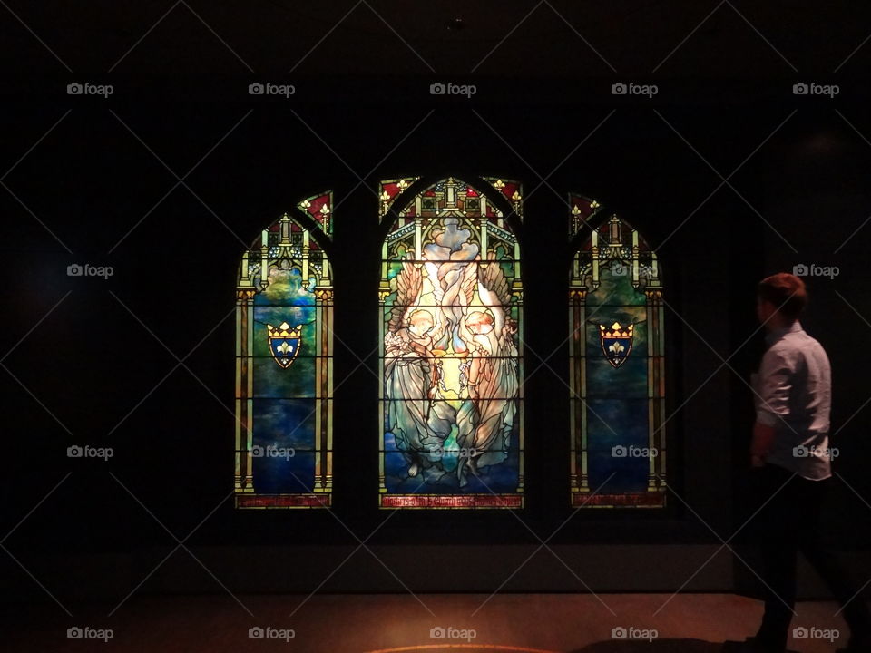 Secret Admirer . A man admiring the stained glass  