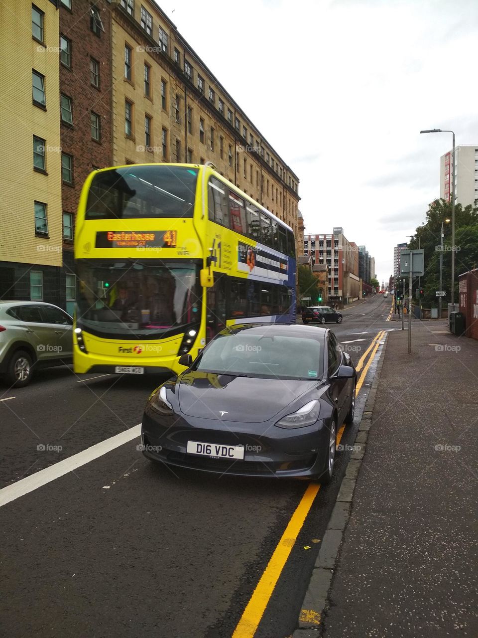 Double decker bus and Tesla