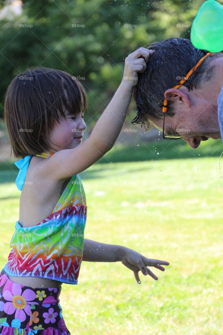 Popping water balloons