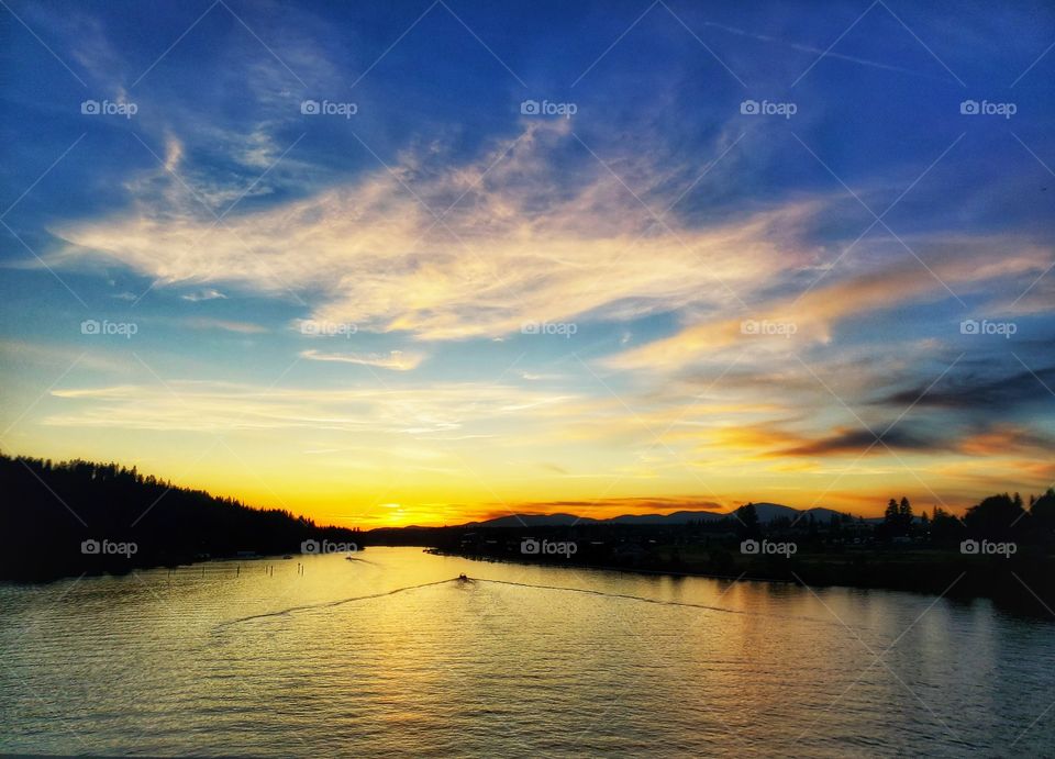sunset over coeur d'alene river in idaho